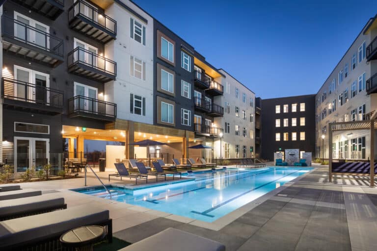 Night time shot of our resort-style swimming pool at Olivine Apartments.